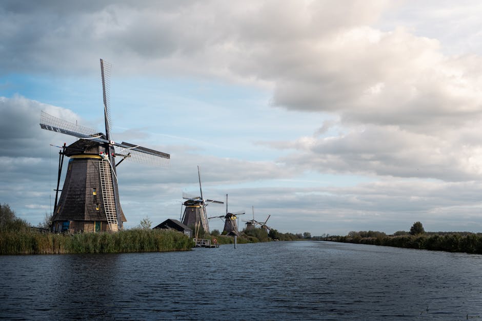 Charming landscape of traditional Dutch windmills along a canal at Kinderdijk, Netherlands.